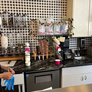 a woman cleaning a counter top