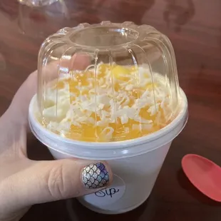 Mango Madness Mango Rolled Ice Cream with Mango fruit, Mango Jellies, Mango Pop, and Coconut Flakes.