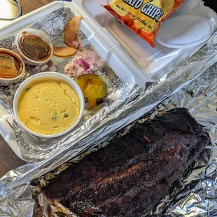 1/2 of rib, jalapeno grits and Backer&apos;s BBQ chip for my sides