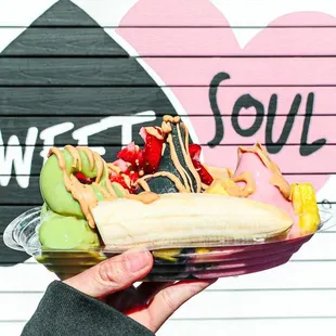 Banana Split- your choice of 3 vegan soft serves with bananas, strawberries, pineapple and choice of drizzle.