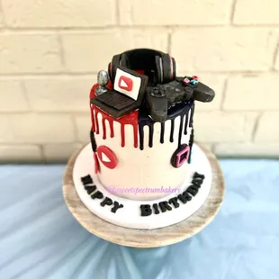 a birthday cake with a camera on top