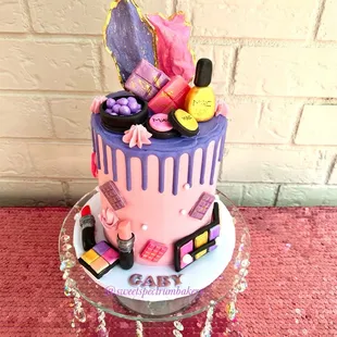 a cake decorated with makeup products
