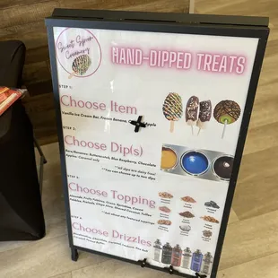a sign for hand - dipped treats