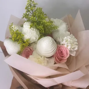 a bouquet of white and pink flowers