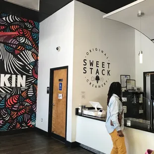 a woman standing in front of the counter