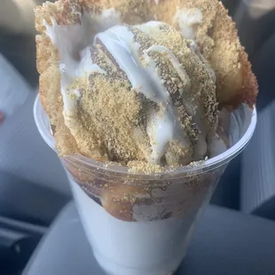 an ice cream sundae in a plastic cup