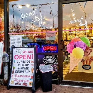 an ice cream shop with a sign for the store