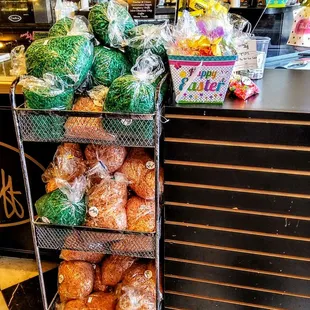 a grocery store with a cart full of doughnuts