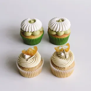 three cupcakes with white frosting