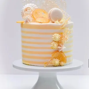 a white and yellow striped cake