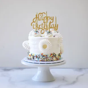 a happy birthday cake with sprinkles