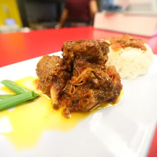 a plate of meatballs and rice