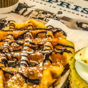 Here&apos;s looking at you waffles draped in chocolate and caramel sauce !