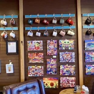 Wall with unique mug display and prints