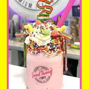 a strawberry milkshake with sprinkles