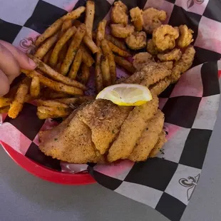 Fried shrimp and fish with French fries