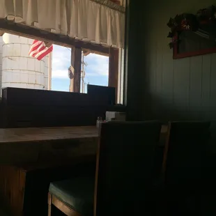 a table and chairs in front of a window