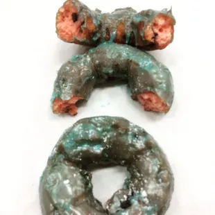 Strawberry chocolate chip cake donut with blue glaze