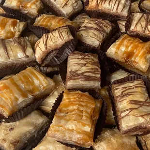 a plate of desserts with caramel drizzle