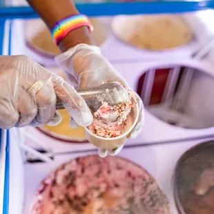  person holding a scoop of ice cream