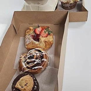 Brookie, pecan roll, strawberry something, blueberry muffin, and two cinnamon rolls
