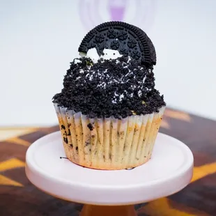 a cupcake with ore cookies on top