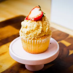 a cupcake with a strawberry on top