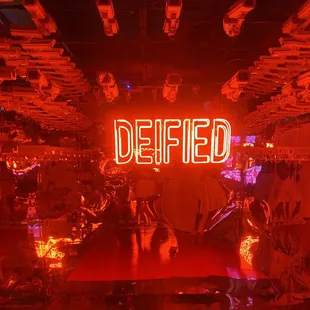 a neon sign that says defiled