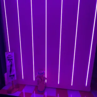 a purple room with a checkered floor