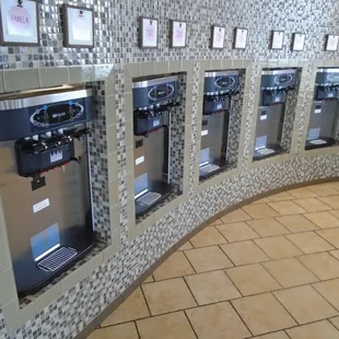 Pick your soft-serve frozen yogurt flavors from these dispensers...
