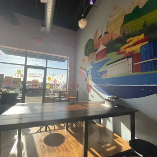 Beautiful wall art and tables that have coloring stuff for kids and even adults!