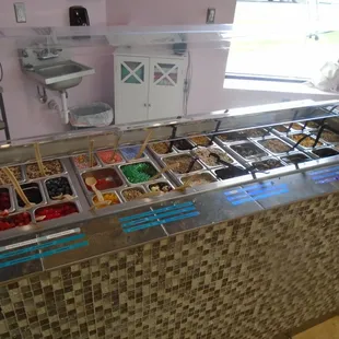 Bar with tons of wet &amp; chilled toppings like fresh fruit, tapioca balls...