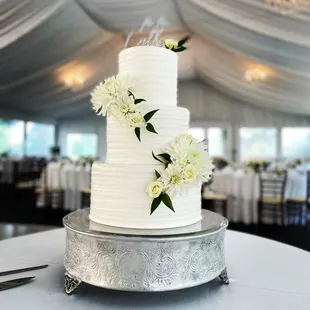 a wedding cake with white flowers