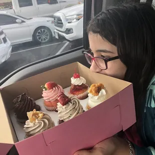 She is sniffing the sweetness!