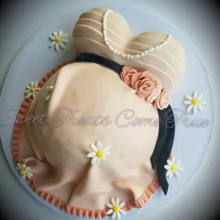 a cake in the shape of a pregnant
