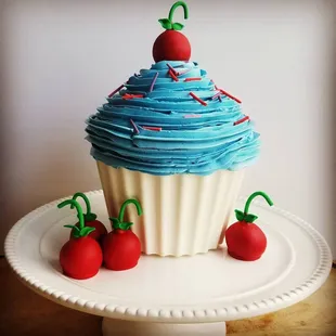 a cupcake with a cherry on top