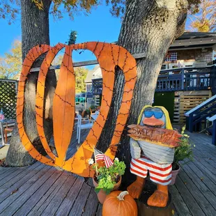 a pumpkin and a scarecrow