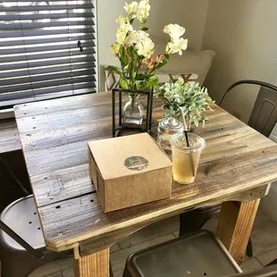 Rustic Modern furniture with natural lighting and real flowers. Very fancy looking!