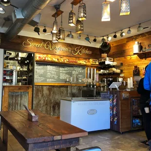 a woman standing in front of the counter