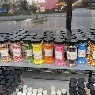 a variety of jars of candy