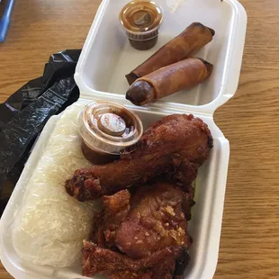 Chicken and rice with two pork egg rolls