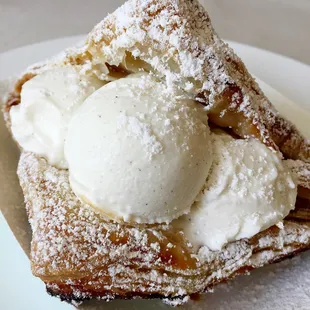 Split apple turnover stuffed with vanilla ice cream