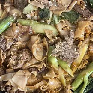 Pad see IW noodle w/beef. Flavorful noodles, meat not so good.