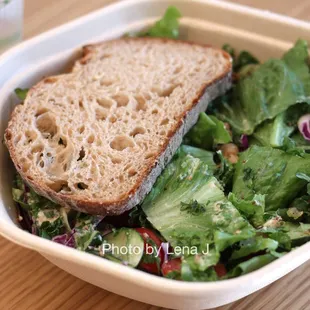 Hummus Crunch Salad - Hummus, olives, chickpeas, tomatoes, cucumbers, cabbage, red onions, basil, za'atar breadcrumbs, pesto vinaigrette