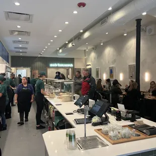 a large group of people in a kitchen