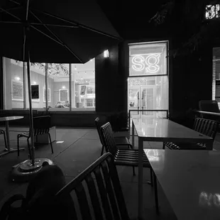 a black and white photo of a restaurant