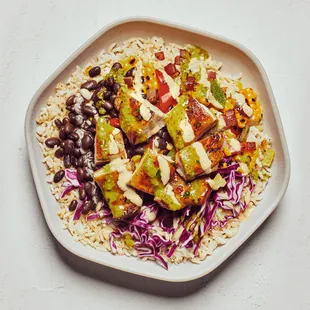 a plate of rice, beans, and tofu