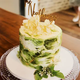 a cake decorated with green and white frosting