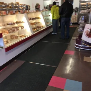 a couple of people standing in front of the counter