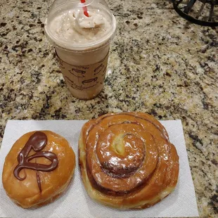 Chocolate cream filled on the left and a cinnamon roll.